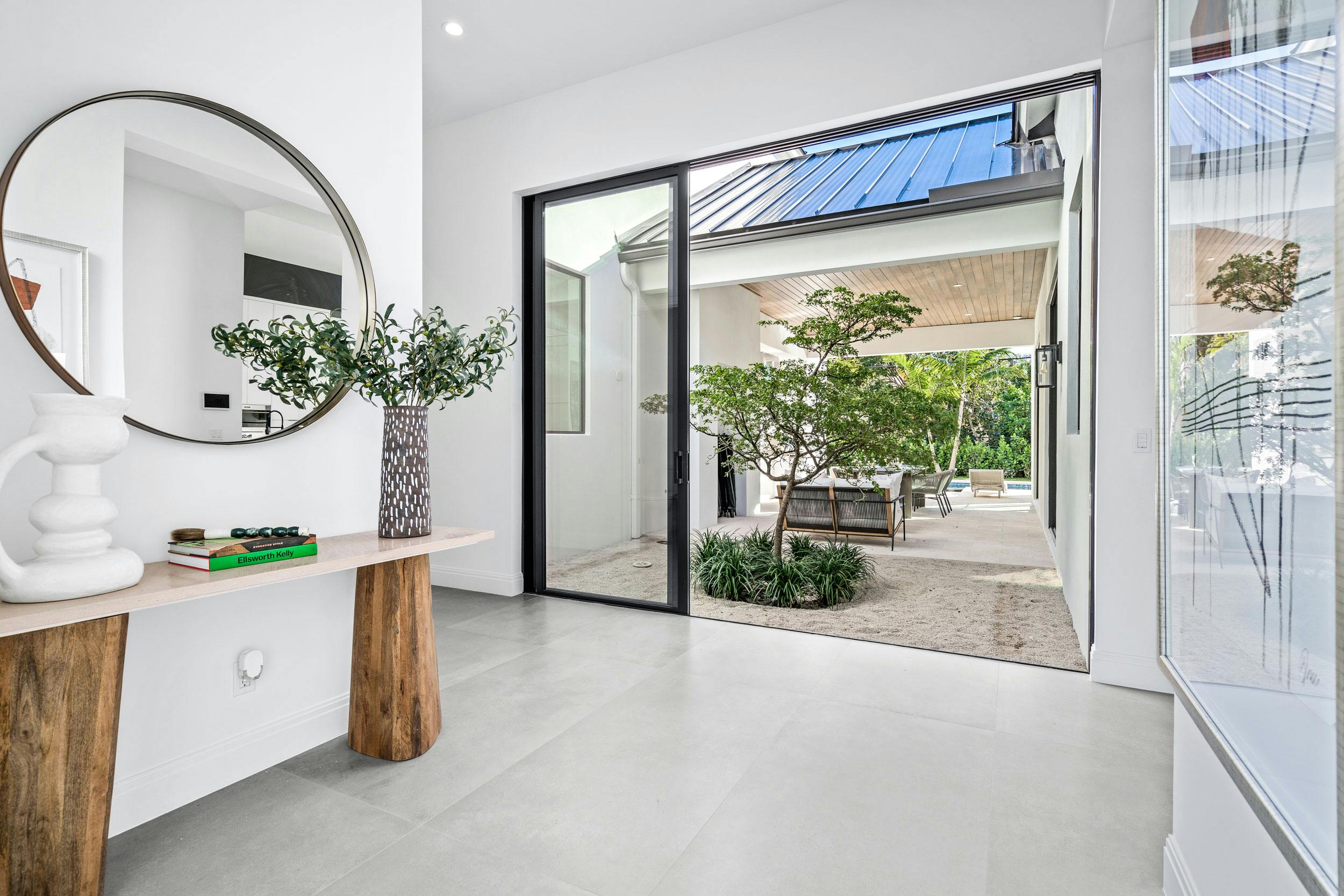 Meridith-Baer-Home-Home-Staging-Florida-Murray-Transitional-Luxury-Homes-Transitional-Hallway-Console-Table-Patio
